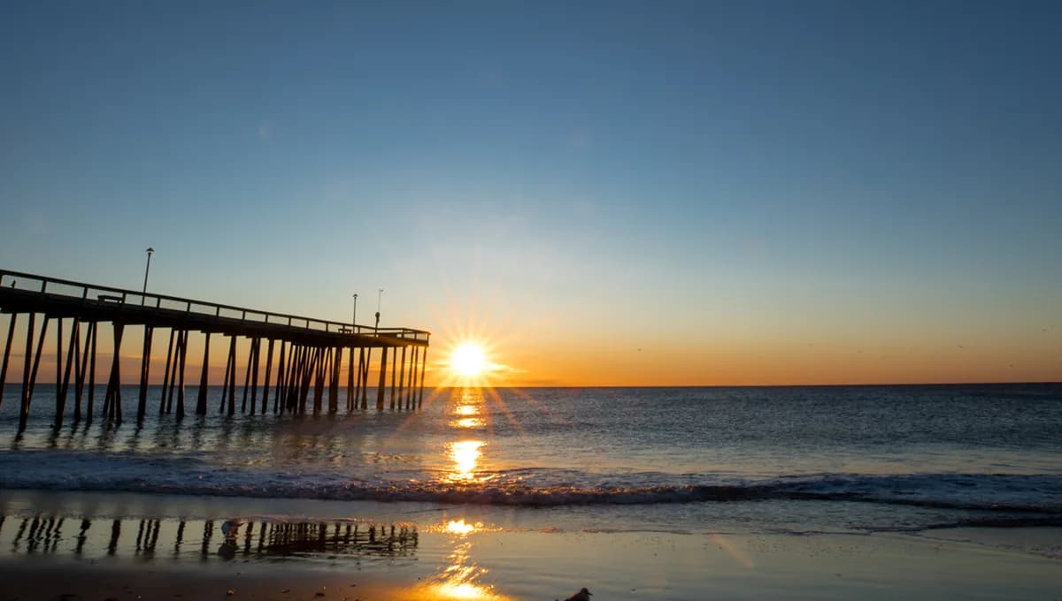 Boardwalk shops and amusements along Ocean City shoreline.