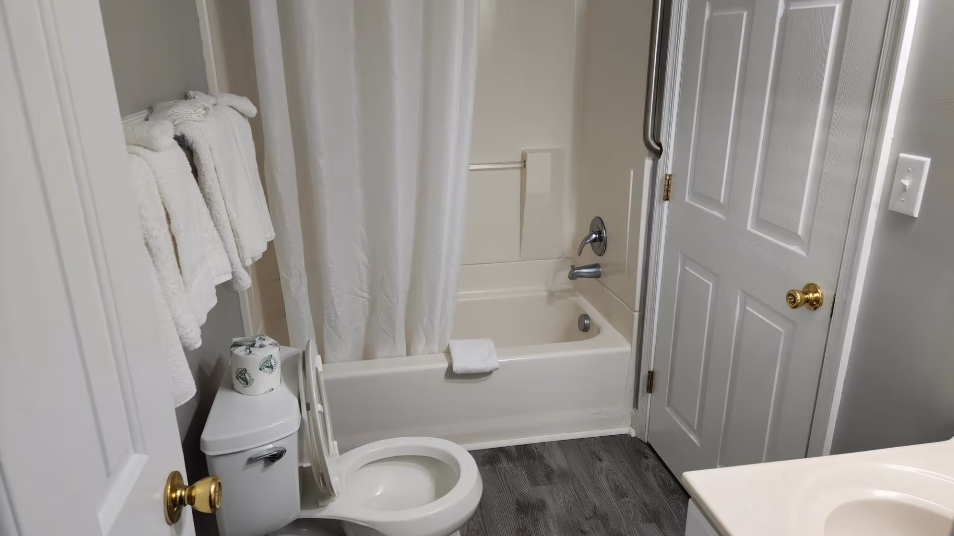 Bright bathroom with tiled shower and clean white finishes