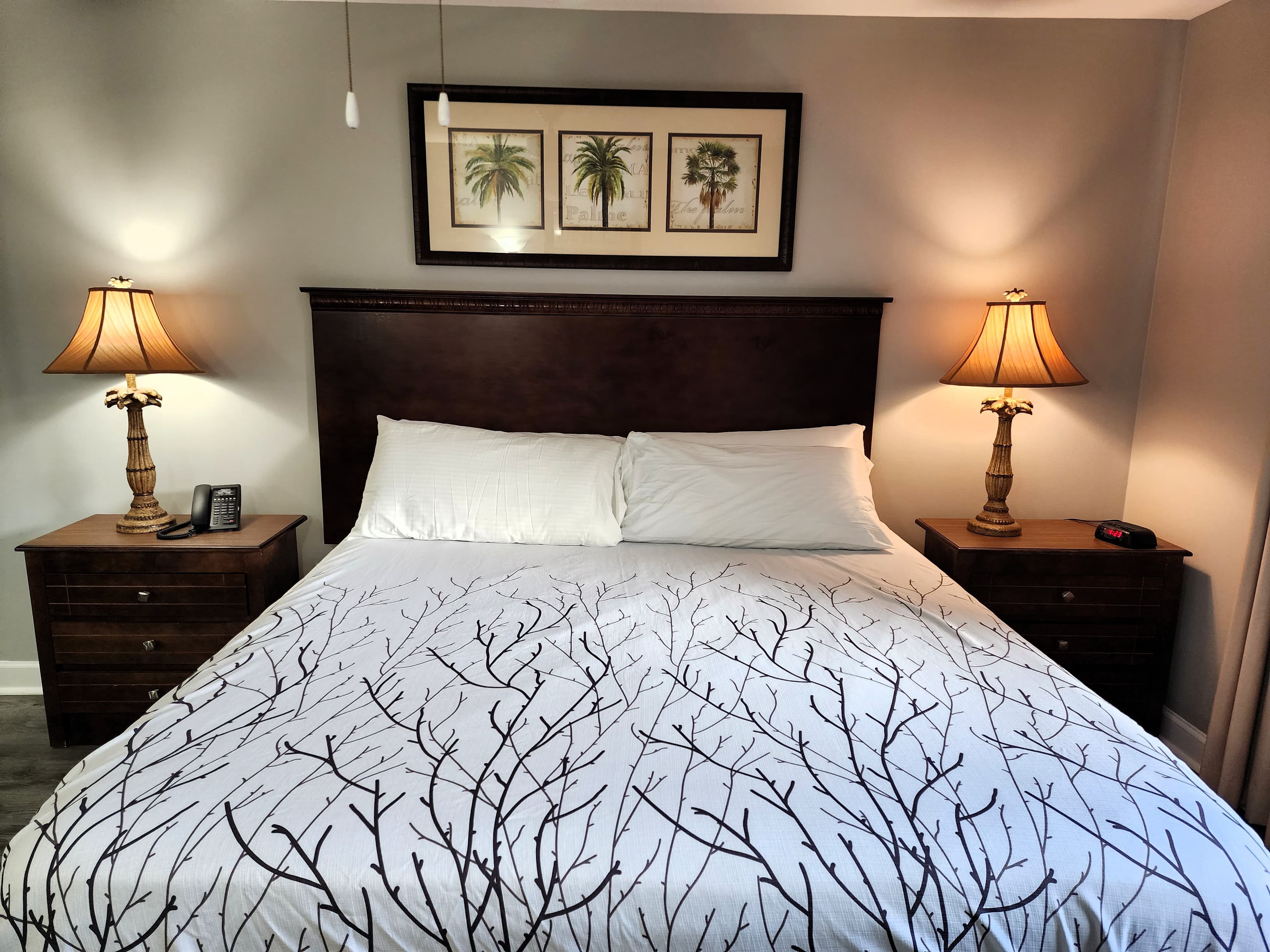 Guest bedroom with twin beds, dresser, and resort décor